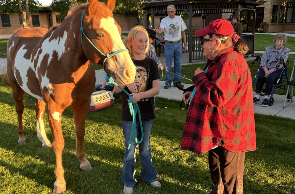 Cowpokes 4-H members at the annual senior center petting zoo. Photo courtesy of Hannah Welfl-Postma.