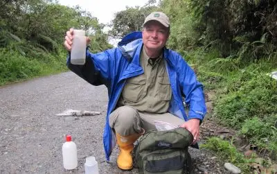 Scott Shaw holds up a plastic bottle.