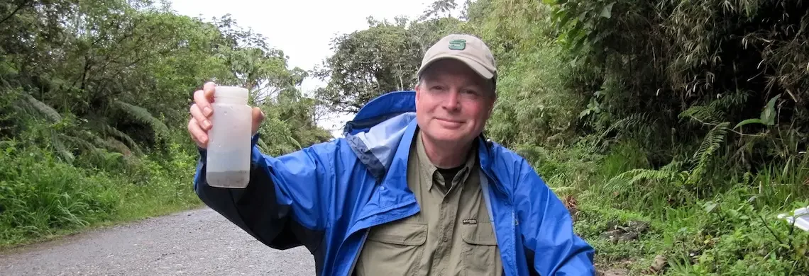 Scott Shaw holds up a plastic bottle.