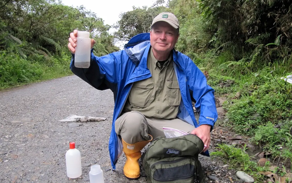 Scott Shaw holds up a plastic bottle.
