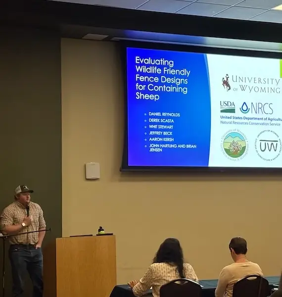 Daniel Reynolds presents his graduate research on evaluating wildlife friendly fence designs for containing sheep