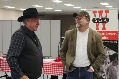 Two men chatting.