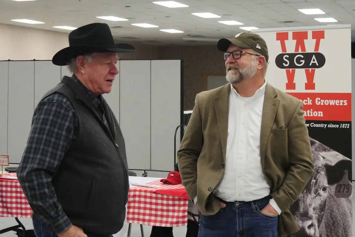 Two men chatting.